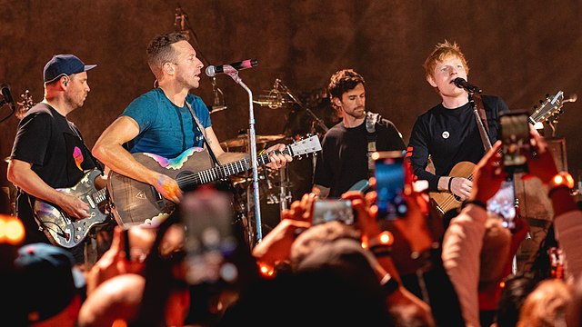 Coldplay with Ed Sheeran joining together in one of their world tour concerts