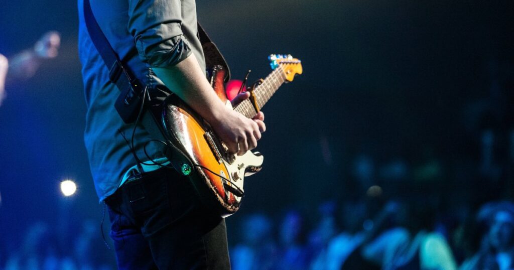 aspiring musician playing a guitar